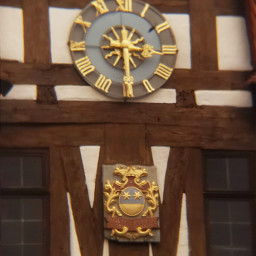 michelstadt oldtown historicalplaces clock crest architecture townhall timberframed historical emblem heraldry gold golden